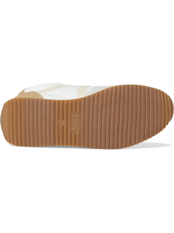 Close-up of a shoe sole with a brand logo on a white background
