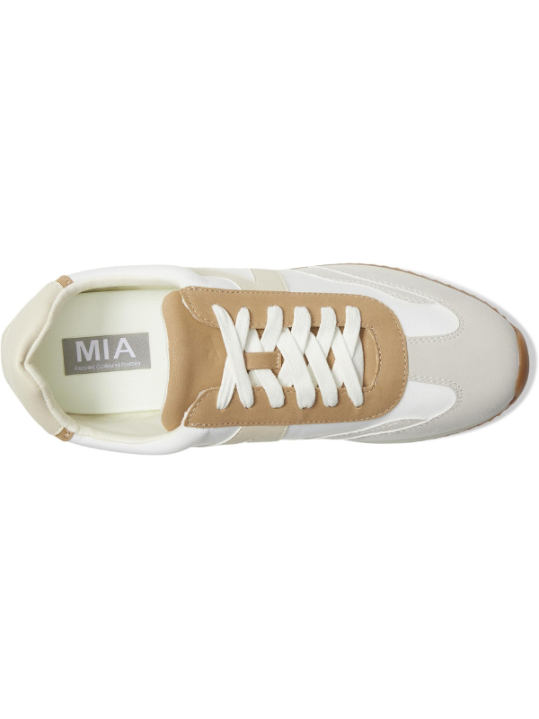 White sneaker with brown accents and white laces on a white background
