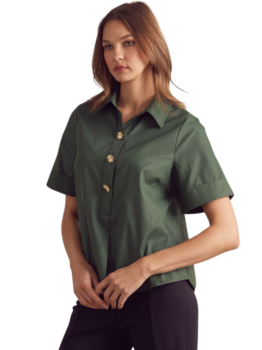 Woman wearing a green short-sleeve shirt on a white background