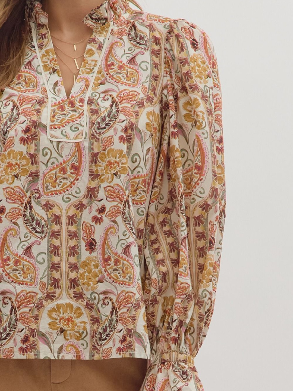 Long-sleeve shirt with a colorful paisley pattern on a plain background