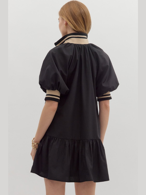 Black dress with sheer sleeves on a white background