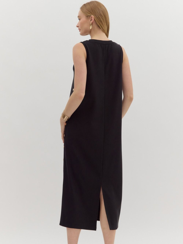 Woman wearing a black sleeveless dress on a white background