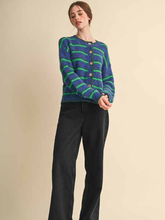 woman wearing a blue and green striped cardigan sweater