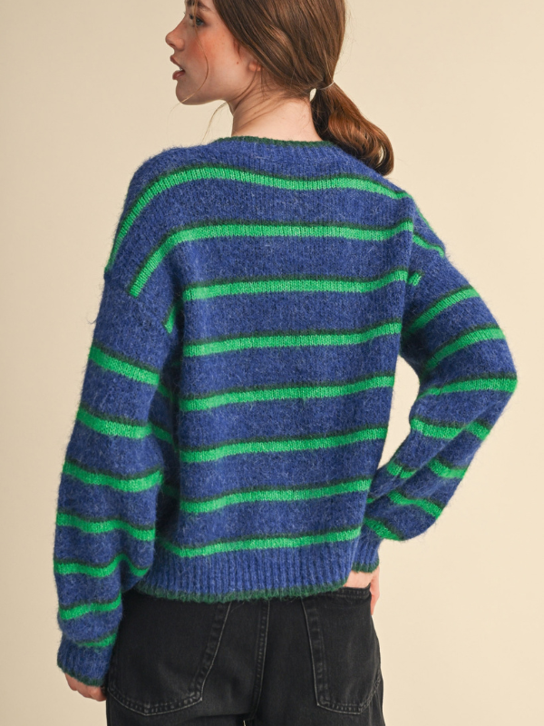 woman wearing a blue and green striped cardigan sweater