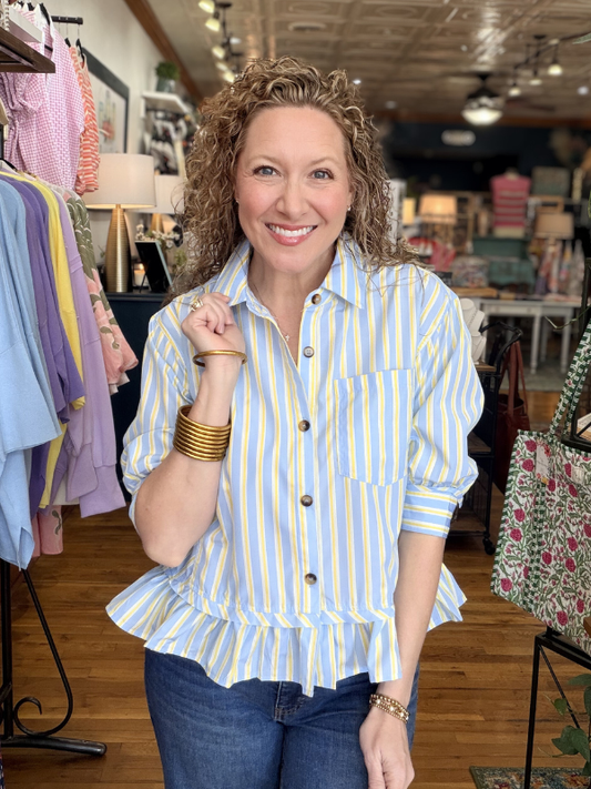 Woman wearing a striped shirt in a clothing store