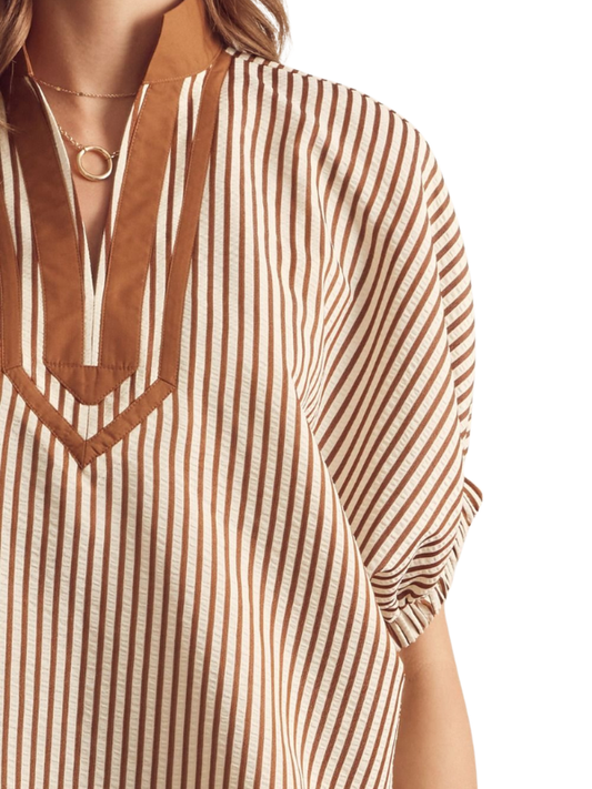 Brown and white striped shirt with a V-neckline on a white background