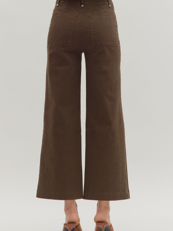 Brown wide-leg pants on a plain background
