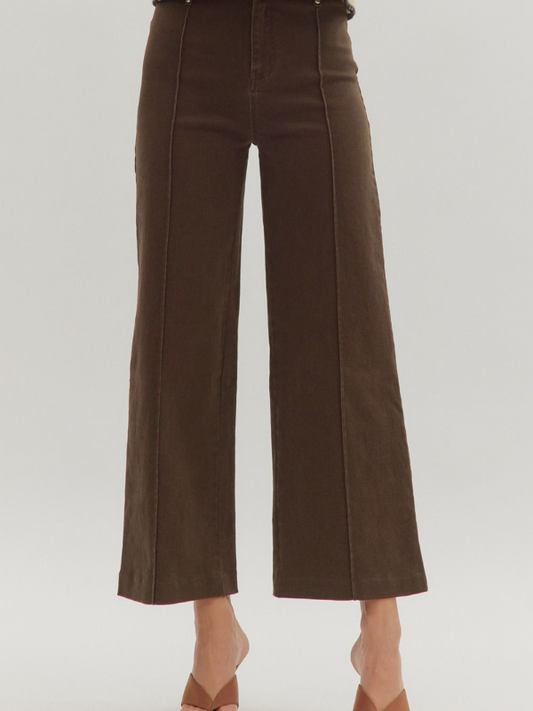 Brown wide-leg pants on a plain background