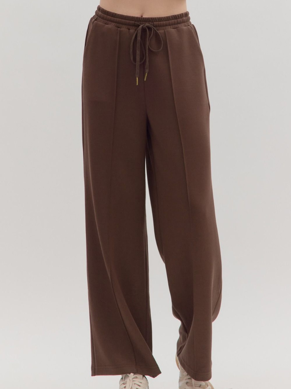 Brown wide-leg pants on a white background