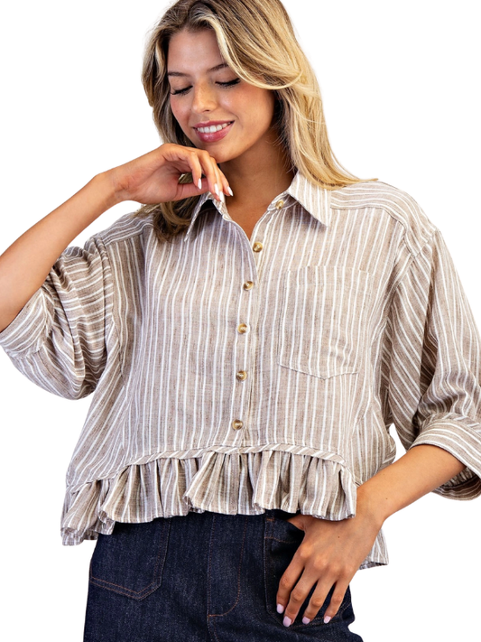 Woman wearing a striped blouse with a white background