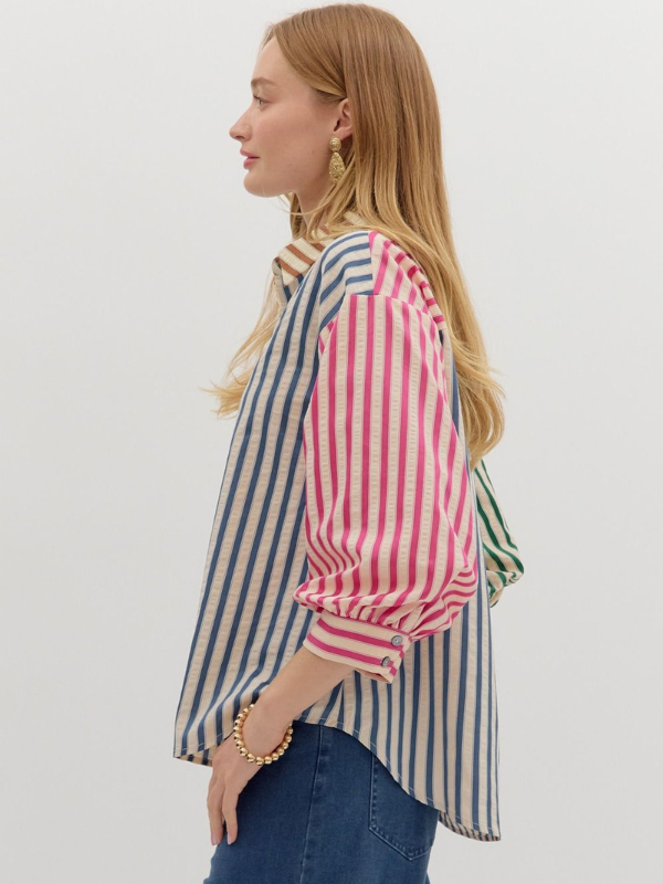 Woman wearing a striped shirt with a white background