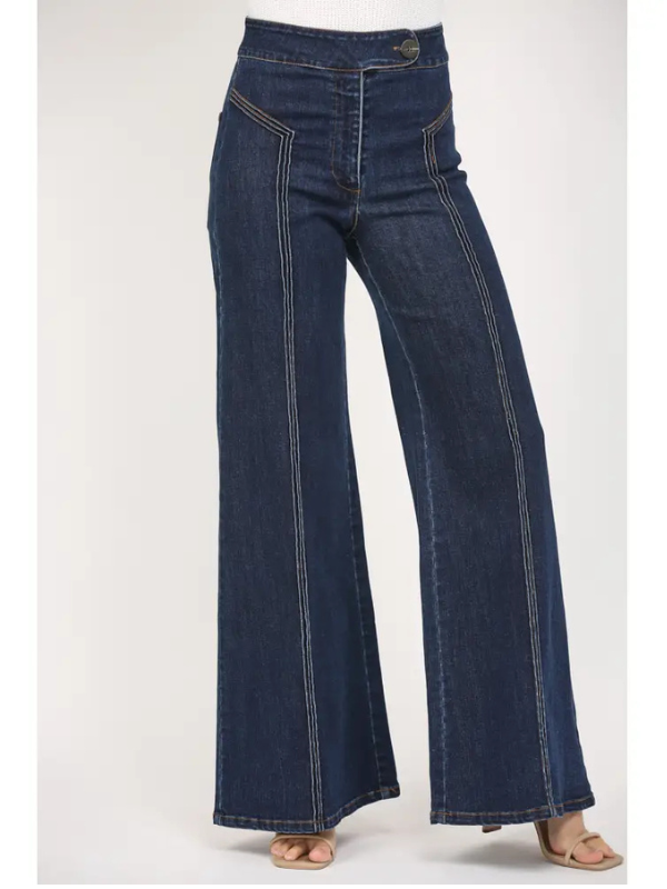 Dark blue flared jeans on a white background