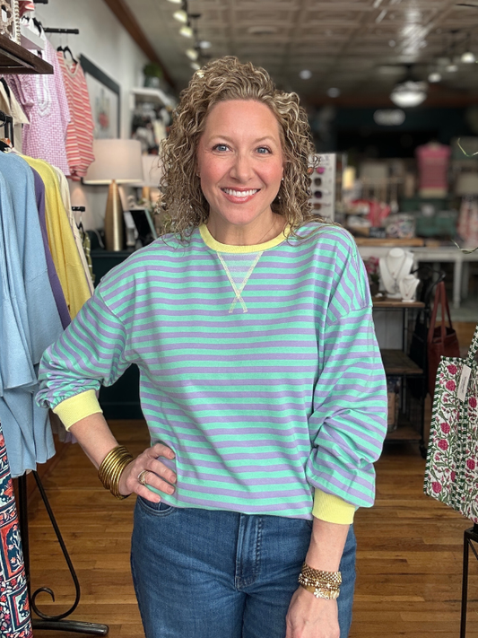 Woman wearing a striped shirt in a clothing store