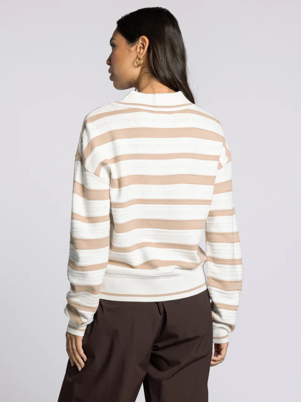 woman wearing brown ivory sweater