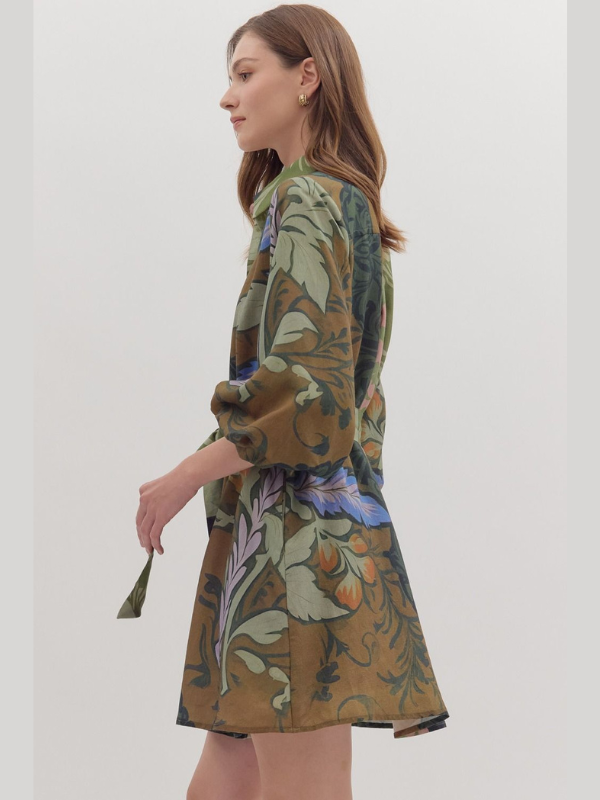 Woman wearing a floral patterned dress against a white background