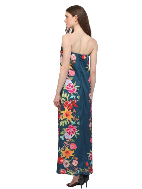 Woman wearing a strapless floral dress with a white background