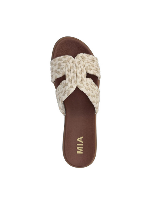 Brown sandal with braided design on a white background