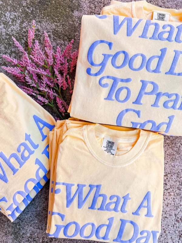 yellow tee shirt that says what a good day to praise God