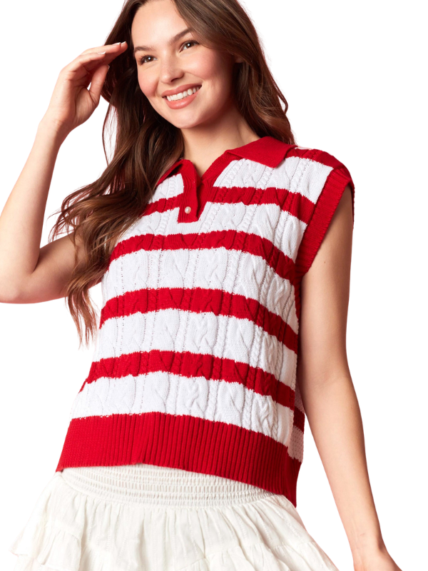 Woman wearing a red and white striped sleeveless sweater on a white background