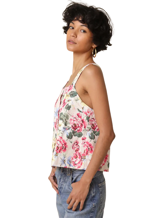 Woman wearing a floral tank top on a white background