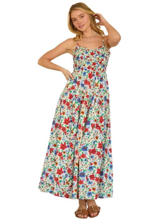 Woman wearing a colorful floral dress on a white background