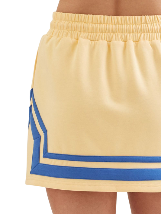 Beige skirt with blue trim on a white background