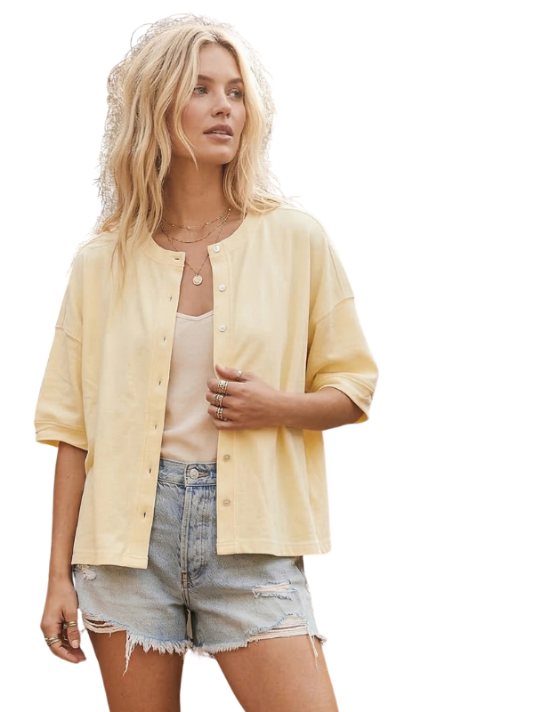 woman wearing light yellow button top