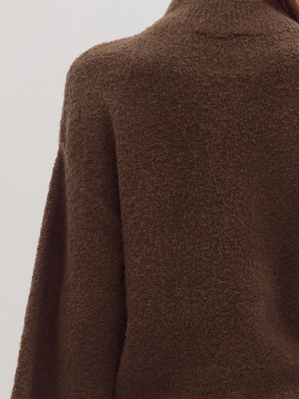 Brown textured fabric on a plain background