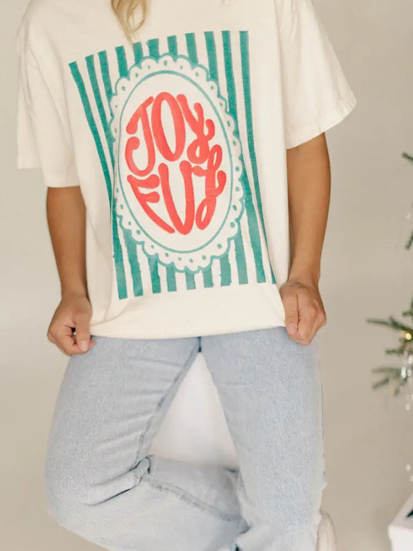 Person wearing a t-shirt with 'Joyful' design in a decorative circle.