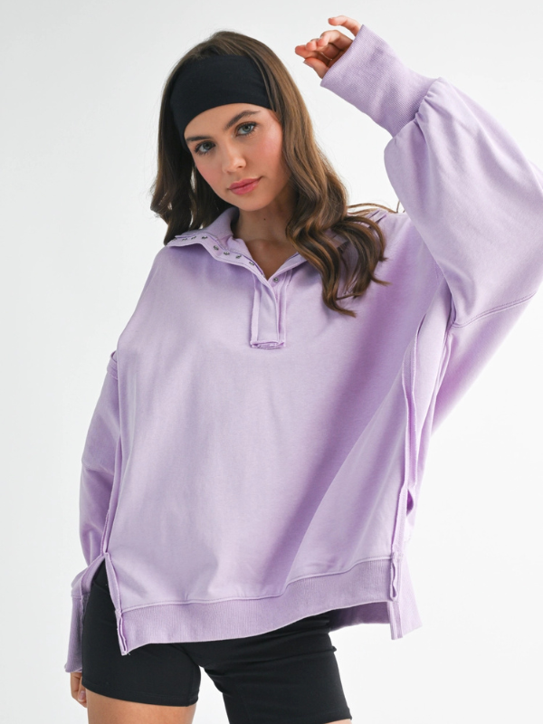 Woman wearing a light purple hoodie on a white background