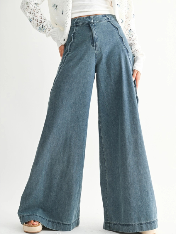 Wide-leg jeans worn by a person on a white background