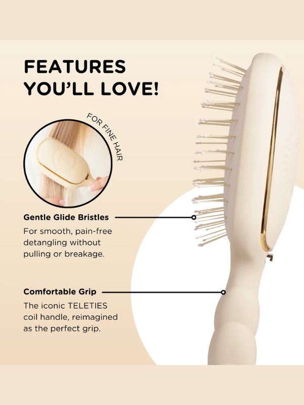 Hairbrush with features highlighted on a beige background