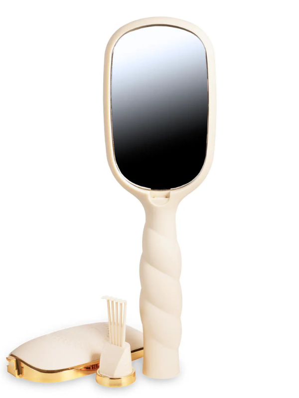 Beige handheld mirror with gold accents on a white background