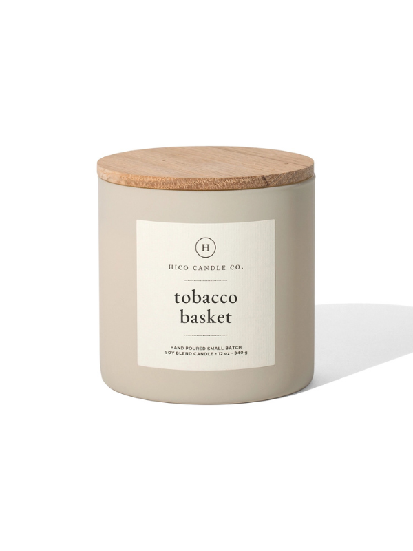 Candle with a wooden lid and label on a white background