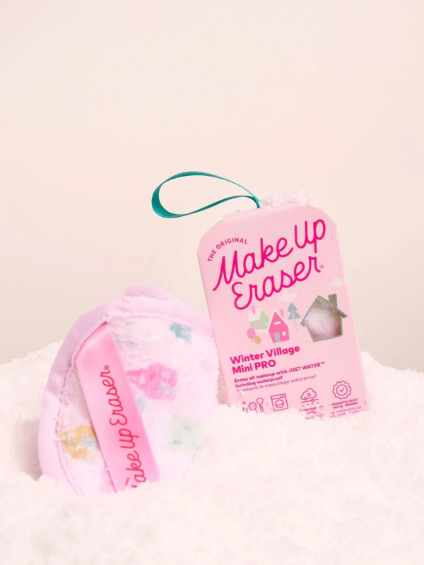 Make-up eraser with 'Winter Village' design on a light pink background