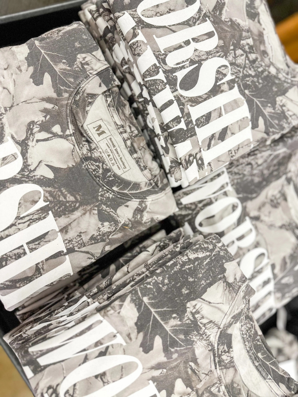 Stack of black and white patterned boxes with visible brand name.