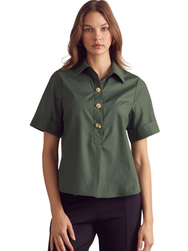 Woman wearing a green short-sleeve blouse on a white background