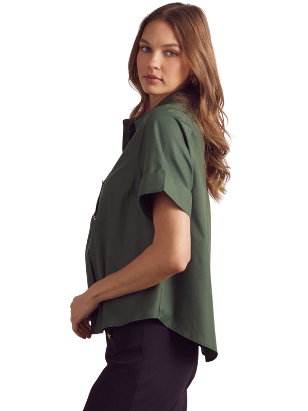 Woman wearing a green shirt on a white background
