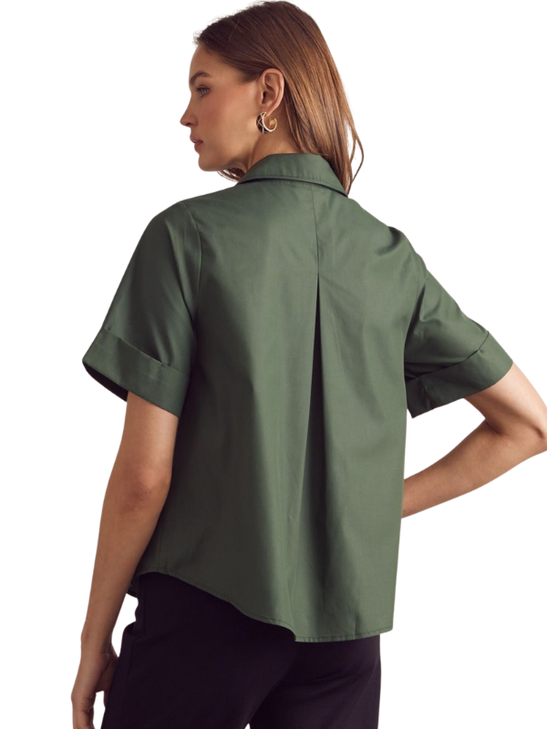 Woman wearing a green shirt on a white background