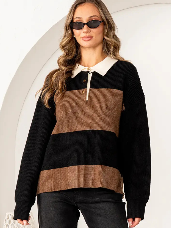 Woman wearing a black and brown striped sweater with a white collar against a neutral background