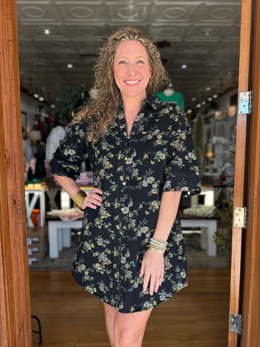 woman wearing black floral dress