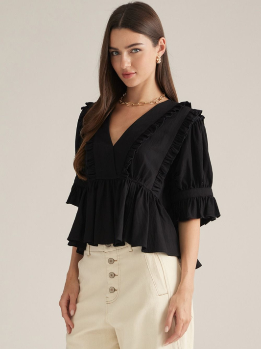 woman wearing a black top with khaki pants