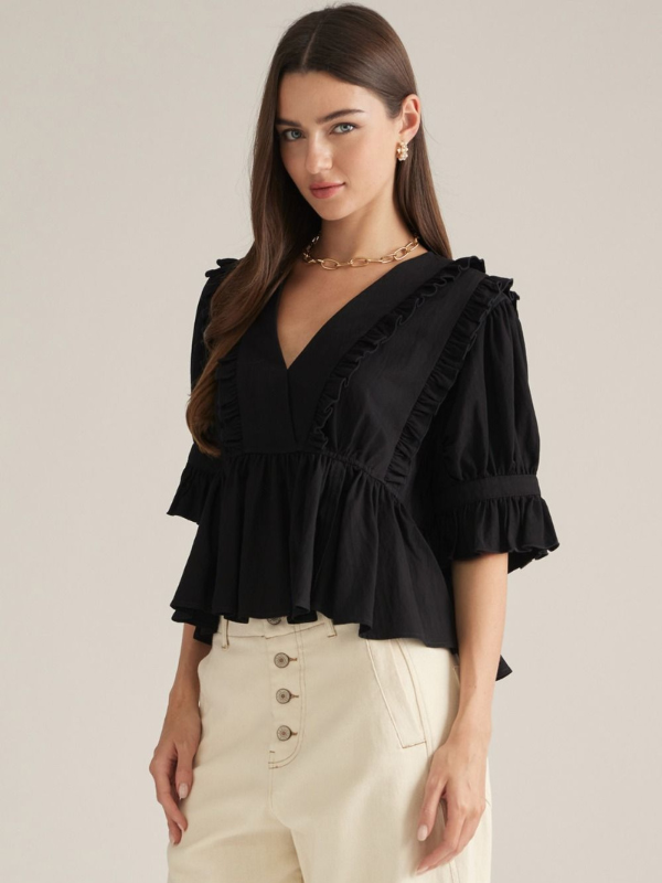 woman wearing a black top with khaki pants