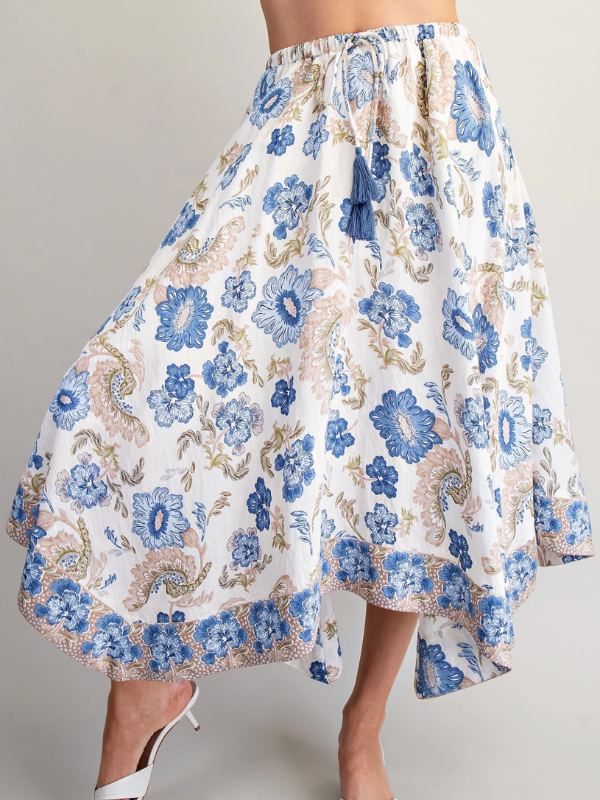 Floral patterned skirt with blue flowers on a plain background