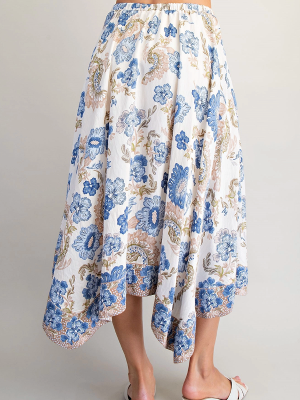 Floral skirt with blue and beige pattern on a plain background
