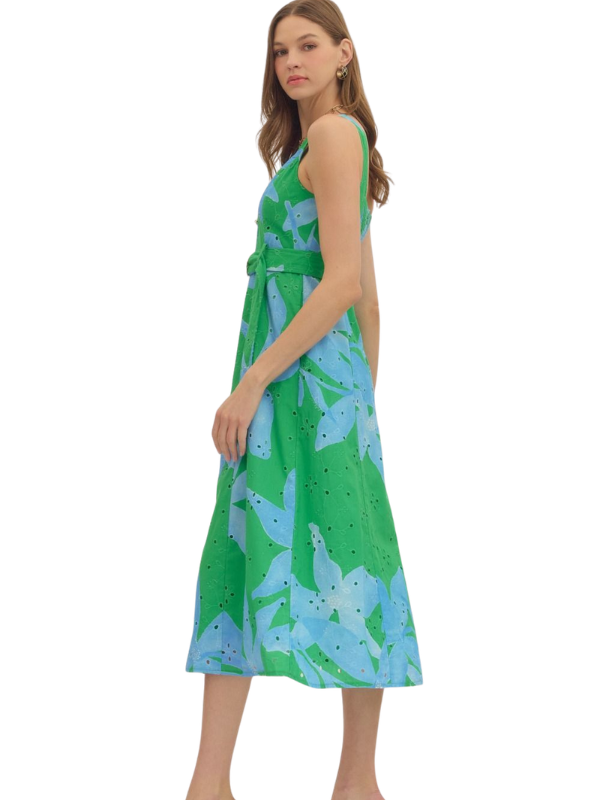 woman wearing a green and blue botanical midi dress 
