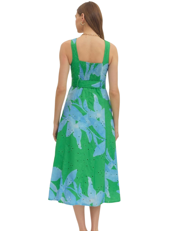 woman wearing a green and blue botanical midi dress 