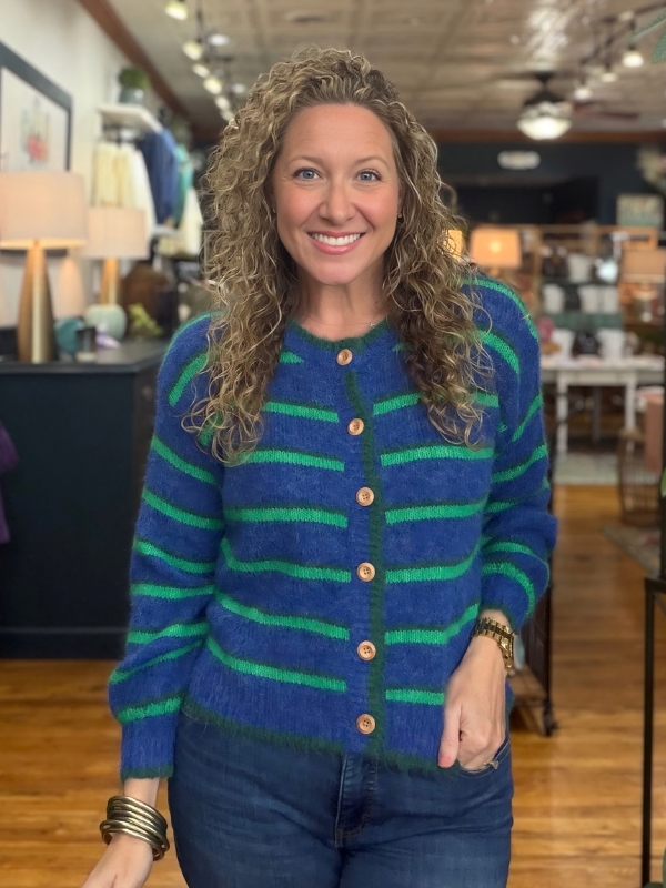 woman wearing a blue and green striped cardigan sweater 