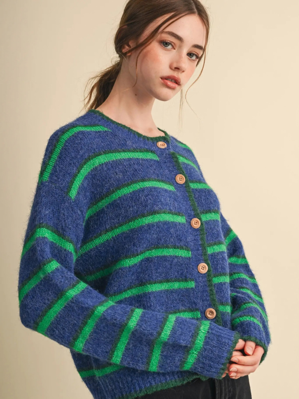 woman wearing a blue and green striped cardigan sweater 