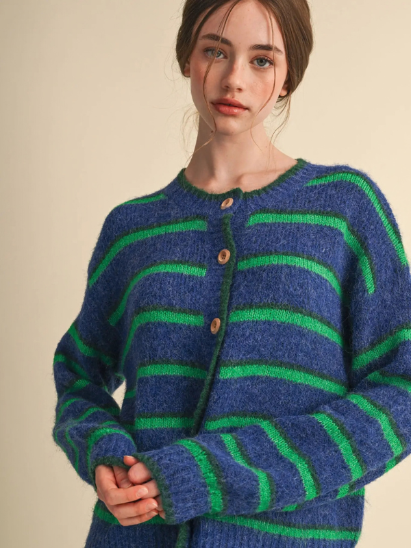 woman wearing a blue and green striped cardigan sweater 